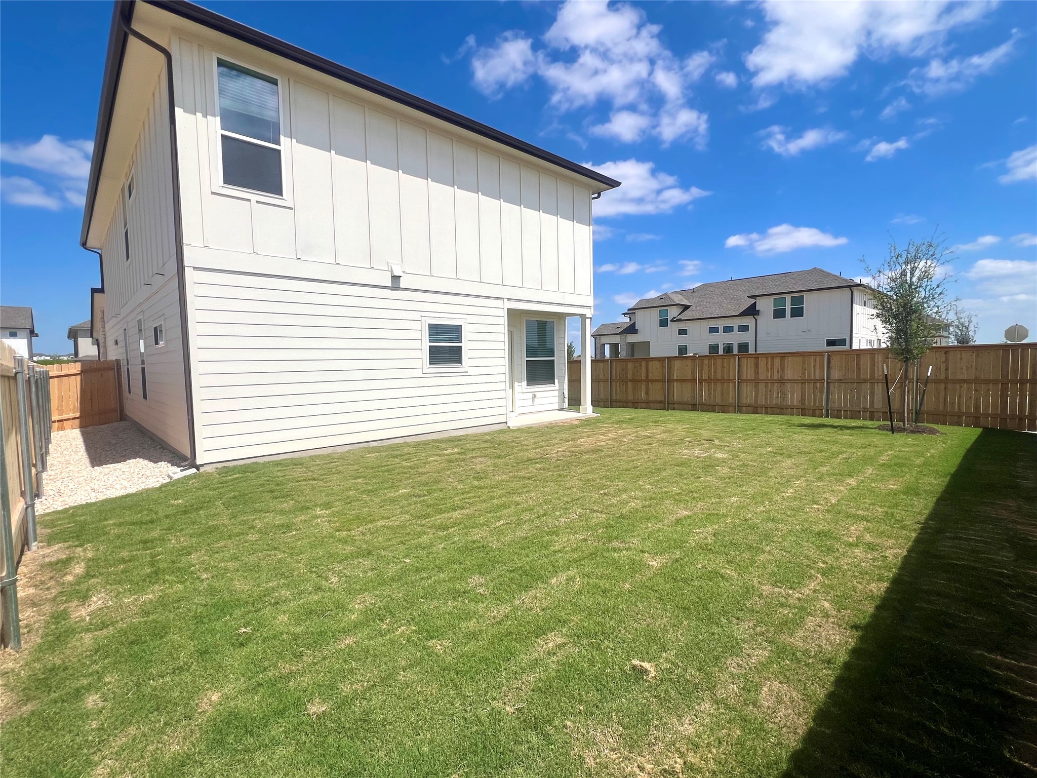 365 Young Street Buda, TX 78610 - Photo 21 of 27 a view of a house with a backyard
