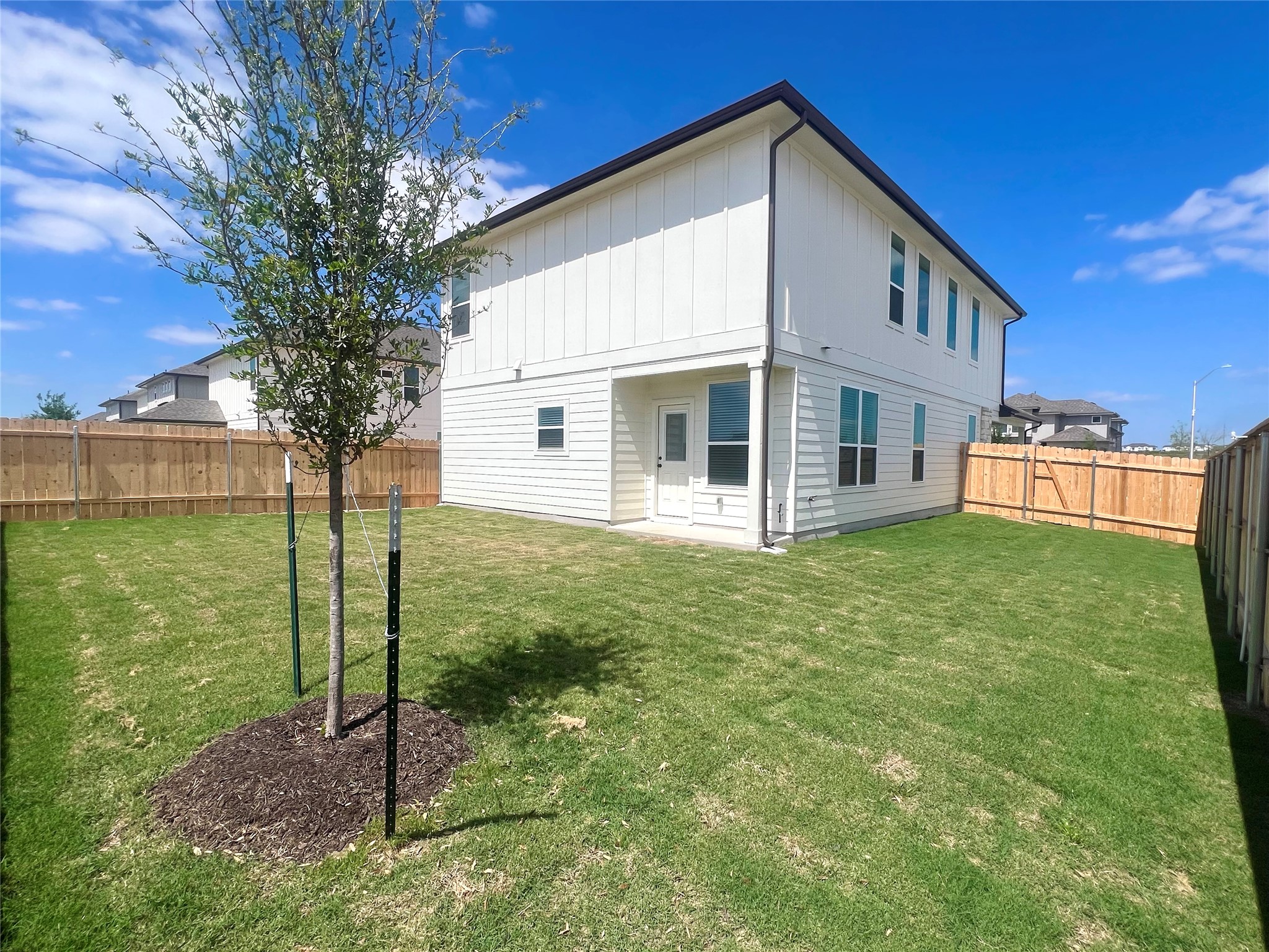 365 Young Street Buda, TX 78610 - Photo 22 of 27 a view of house with backyard