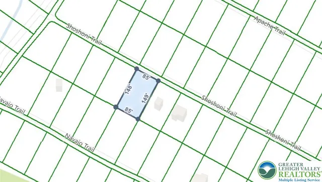 a bathroom with white vanity and shower