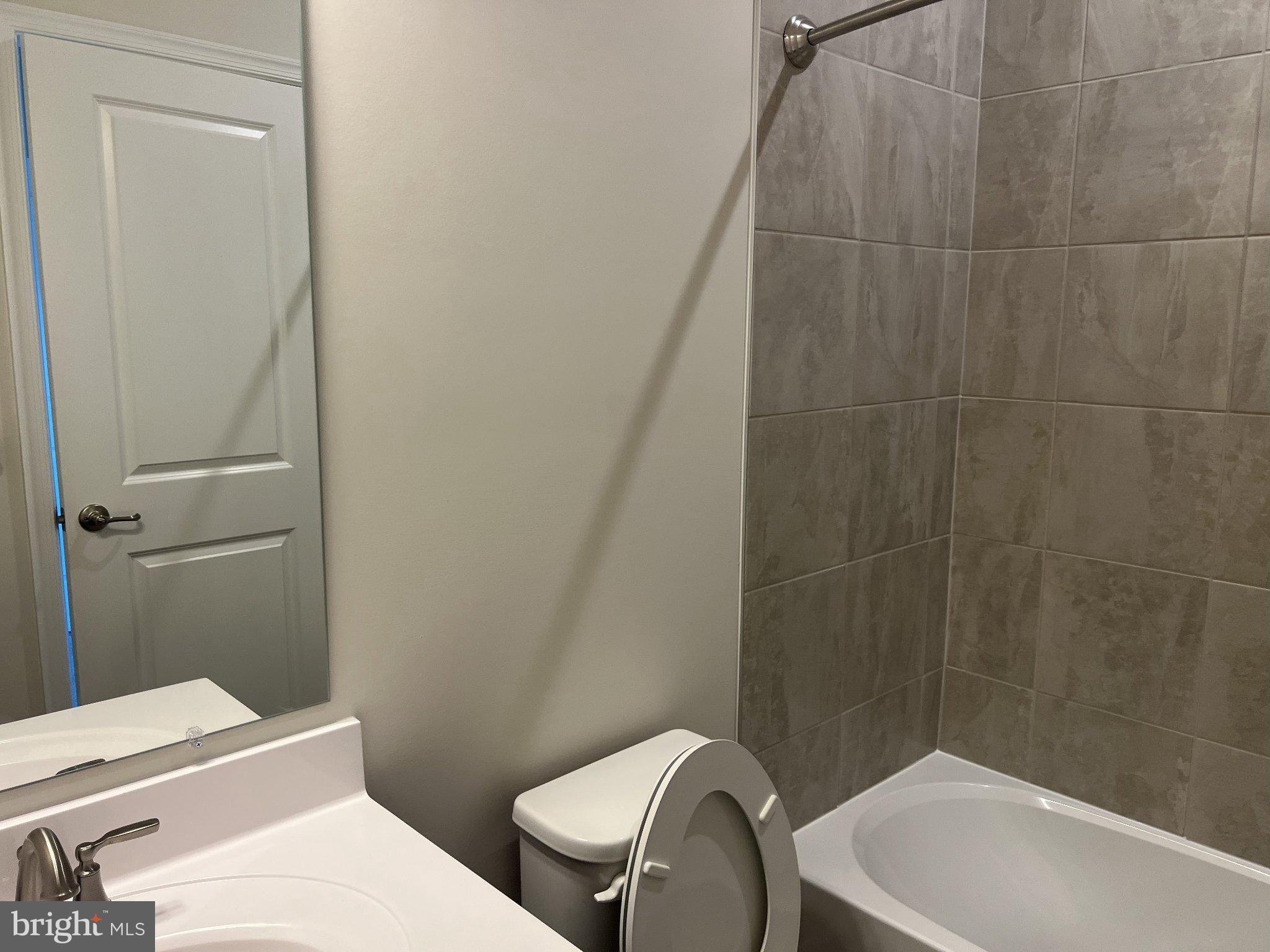 8058 Big Roundtop Road Fort George G Meade, MD 20755 - Photo 19 of 24 a bathroom with a sink a toilet and shower