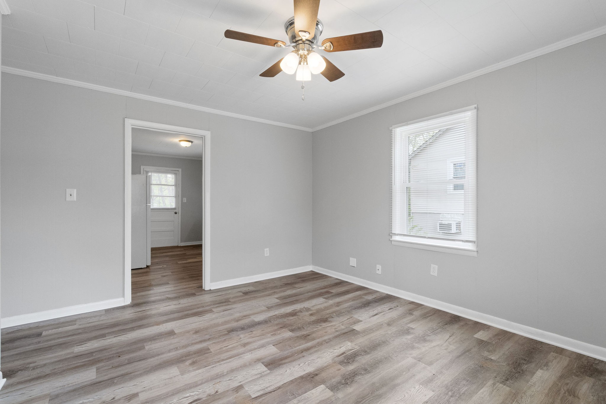 427 Circle Drive, Unit B Clarksville, TN 37043 - Photo 4 of 10 wooden floor in an empty room with a window