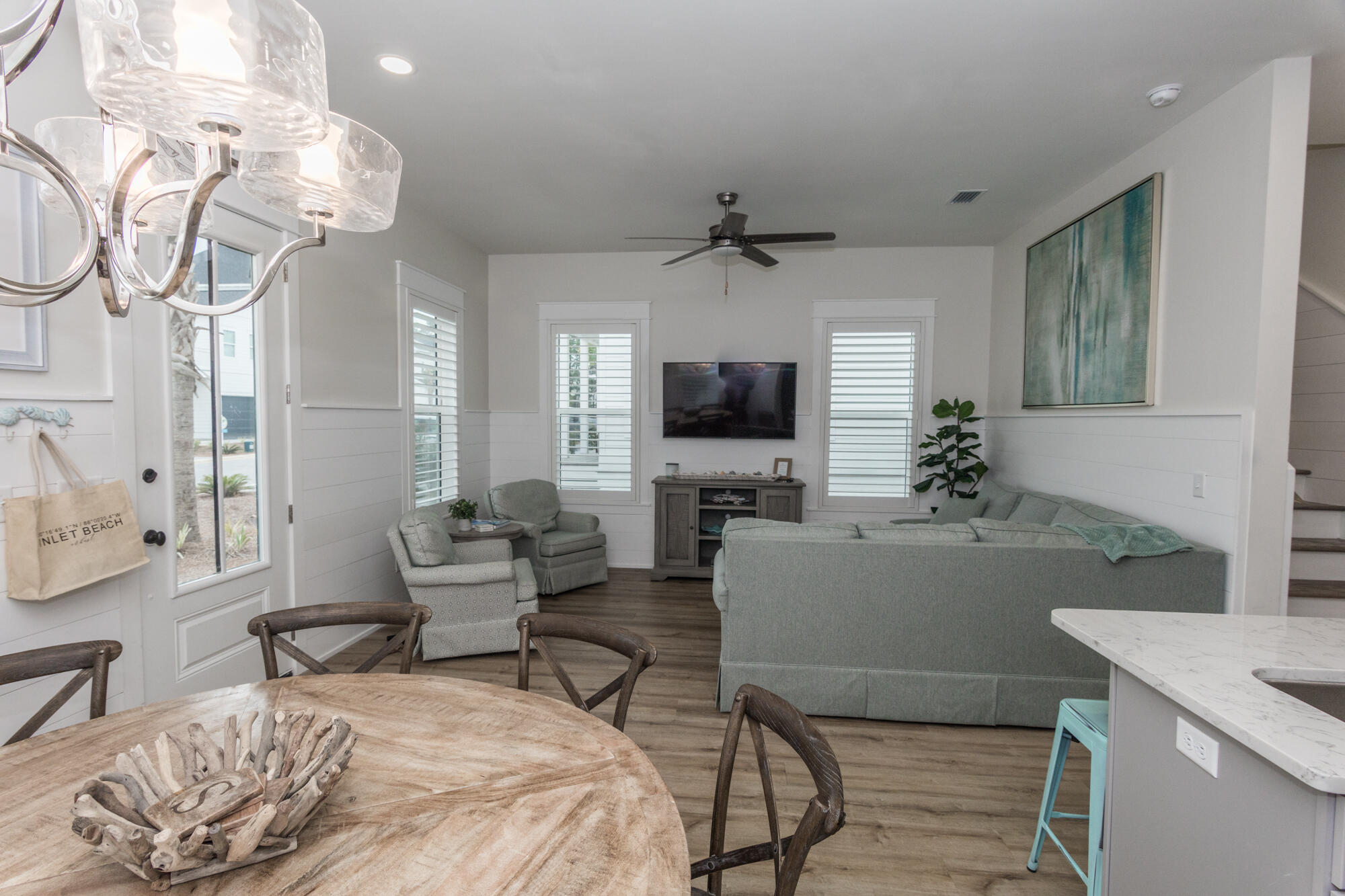 68 Beach View Drive Inlet Beach, FL 32461 - Photo 25 of 78 a living room with furniture a chandelier and a flat screen tv