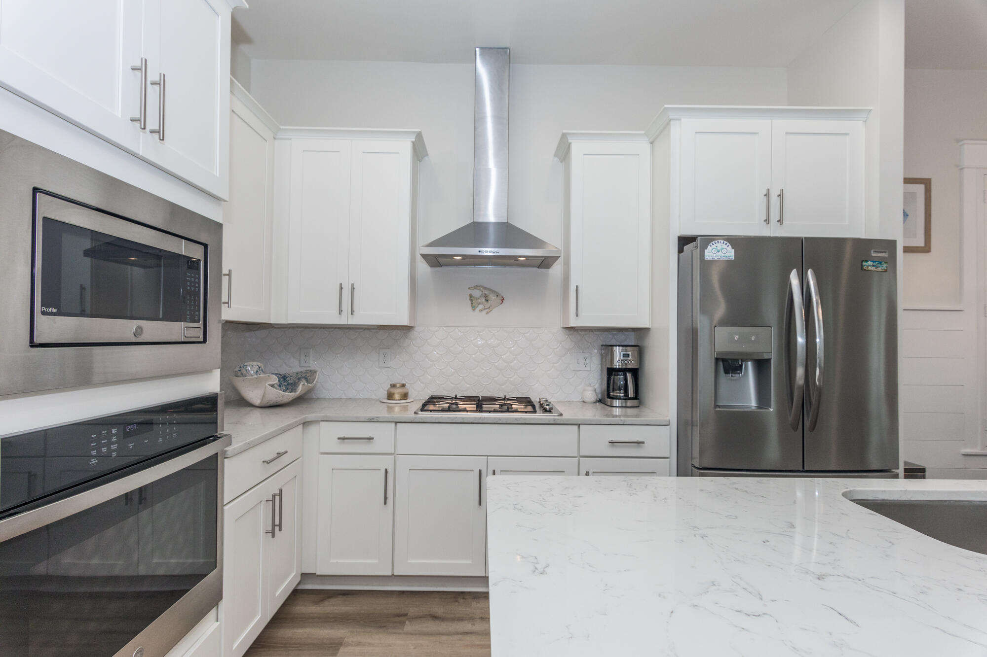 68 Beach View Drive Inlet Beach, FL 32461 - Photo 30 of 78 a kitchen with stainless steel appliances granite countertop a refrigerator stove and sink