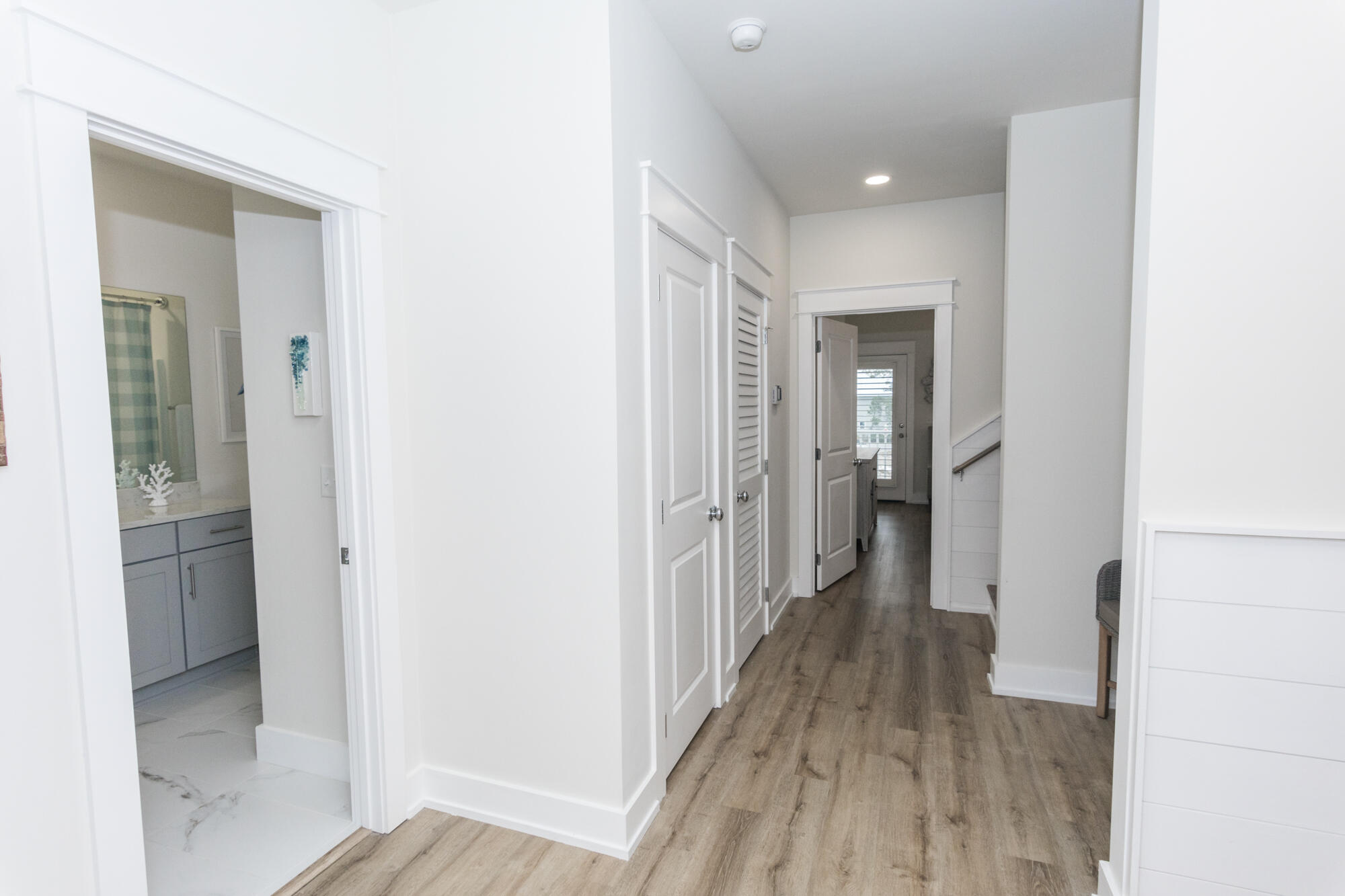 68 Beach View Drive Inlet Beach, FL 32461 - Photo 41 of 78 a view of a hallway with wooden floor and a bathroom
