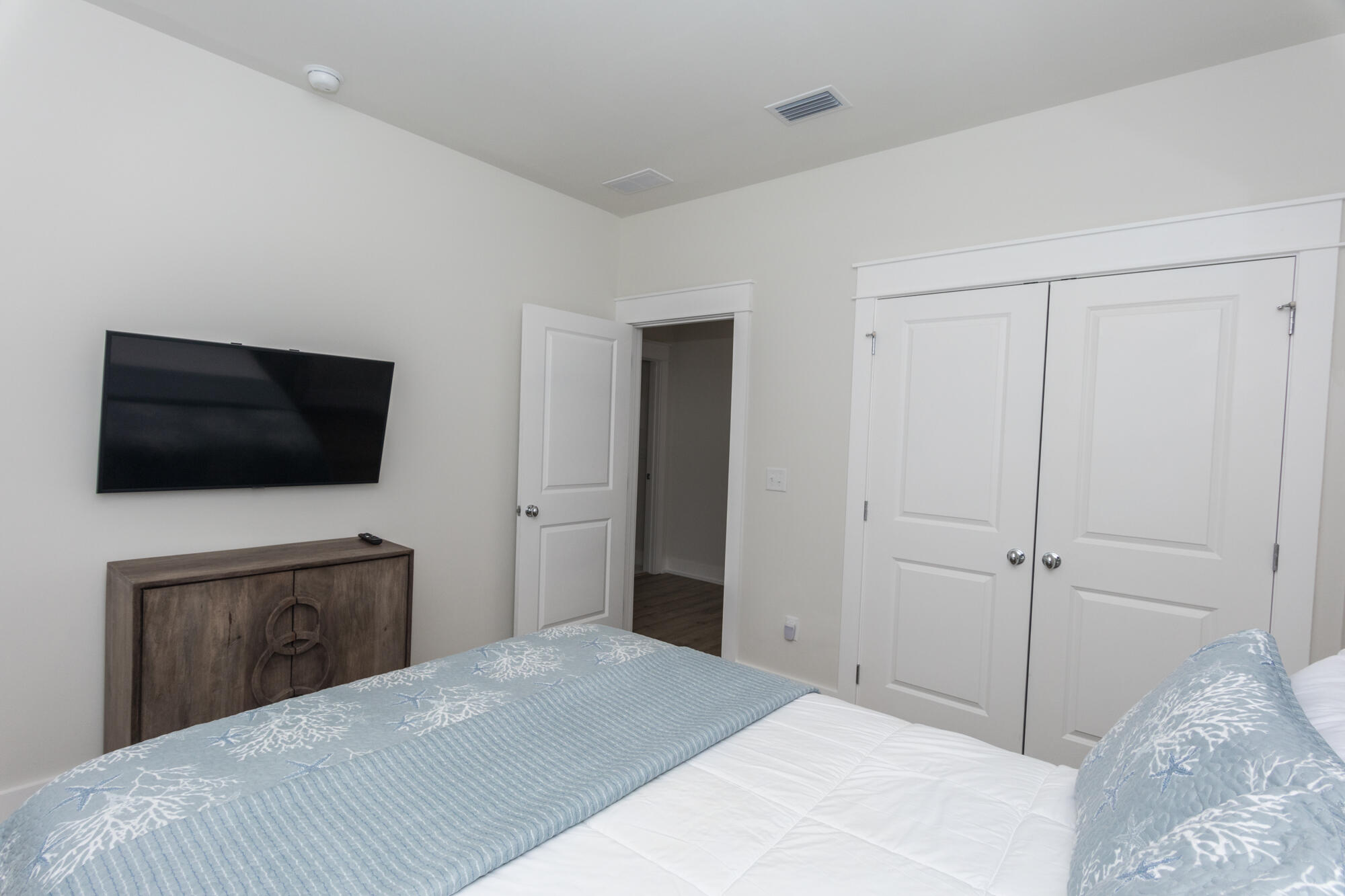 68 Beach View Drive Inlet Beach, FL 32461 - Photo 45 of 78 a bedroom with a bed and a flat screen tv