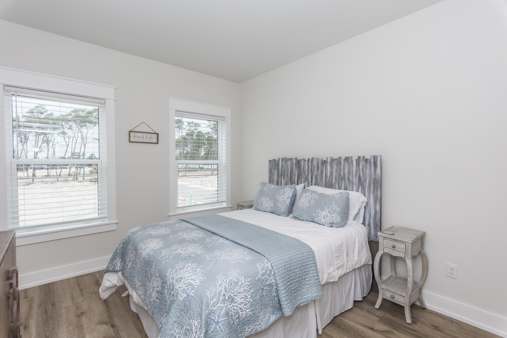 68 Beach View Drive Inlet Beach, FL 32461 - Photo 46 of 78 a bedroom with a bed and wooden floor