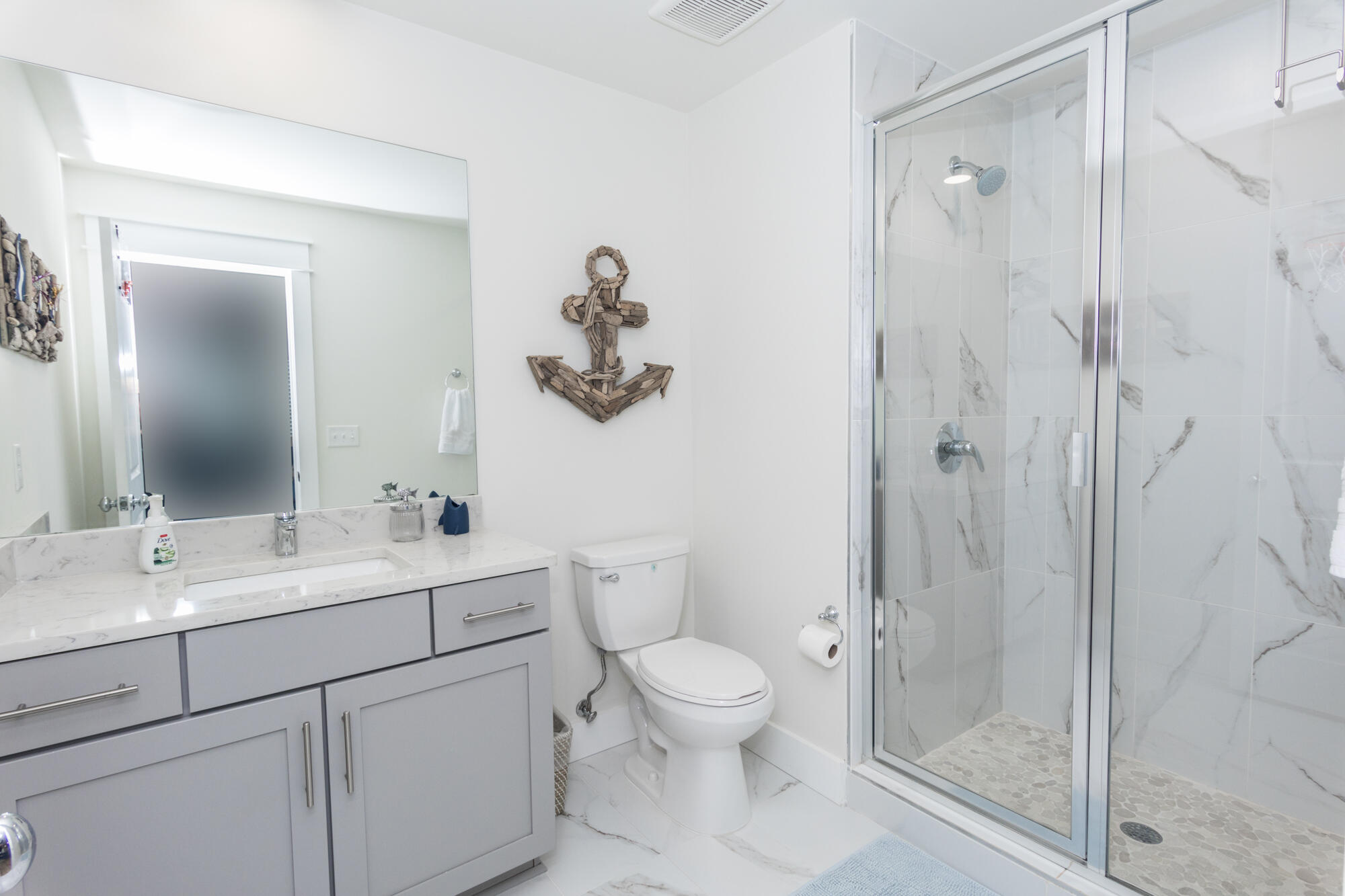68 Beach View Drive Inlet Beach, FL 32461 - Photo 66 of 78 a bathroom with a toilet sink vanity and mirror