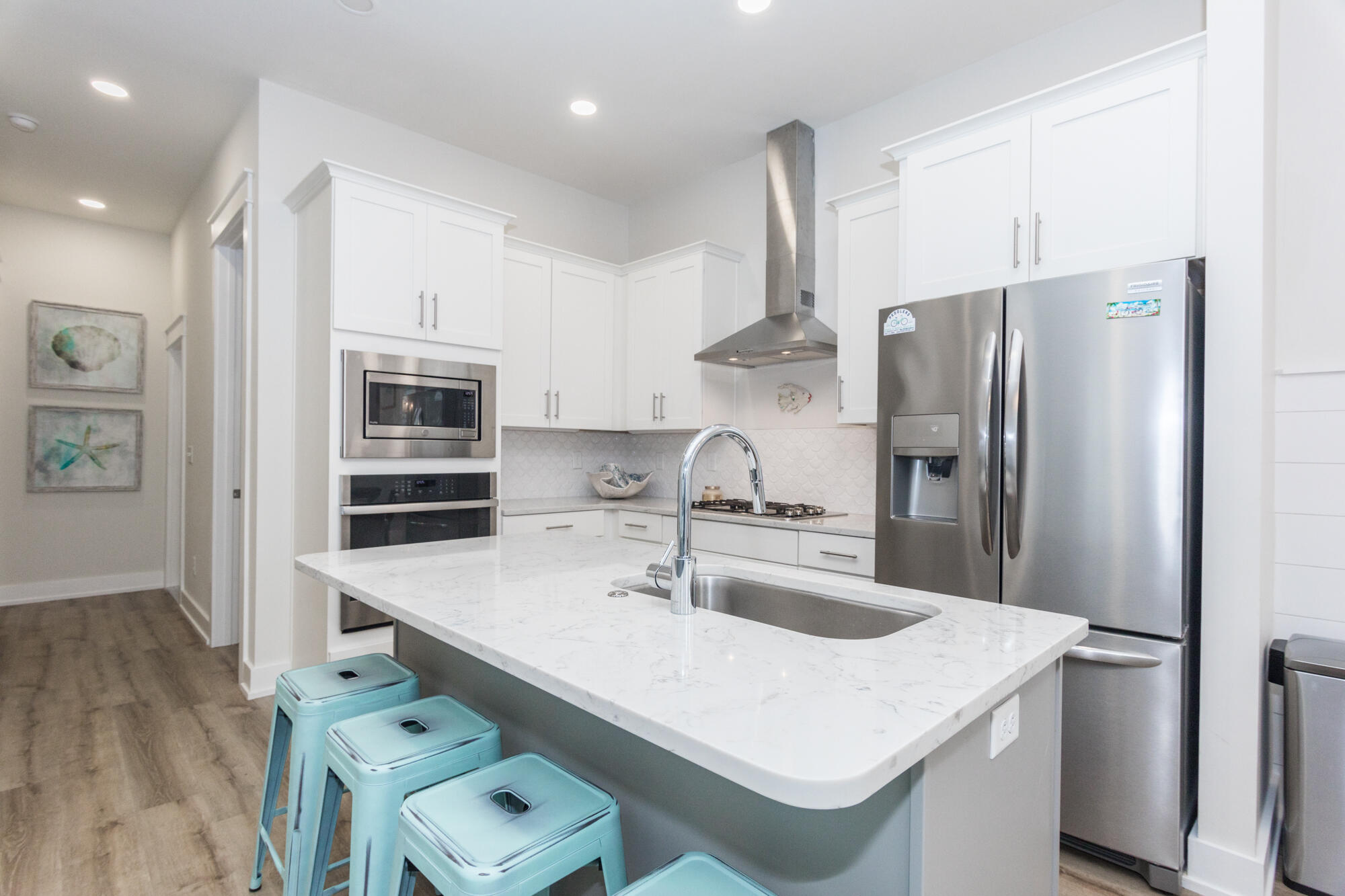 68 Beach View Drive Inlet Beach, FL 32461 - Photo 10 of 78 a kitchen with stainless steel appliances a sink a stove a refrigerator and cabinets