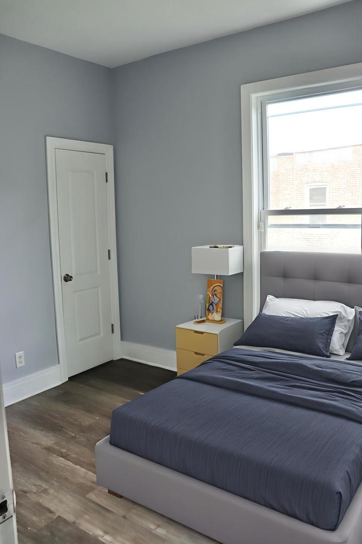 5718 South Sangamon Street, Unit 2 Chicago, IL 60621 - Photo 16 of 35 a bedroom with two beds and a window