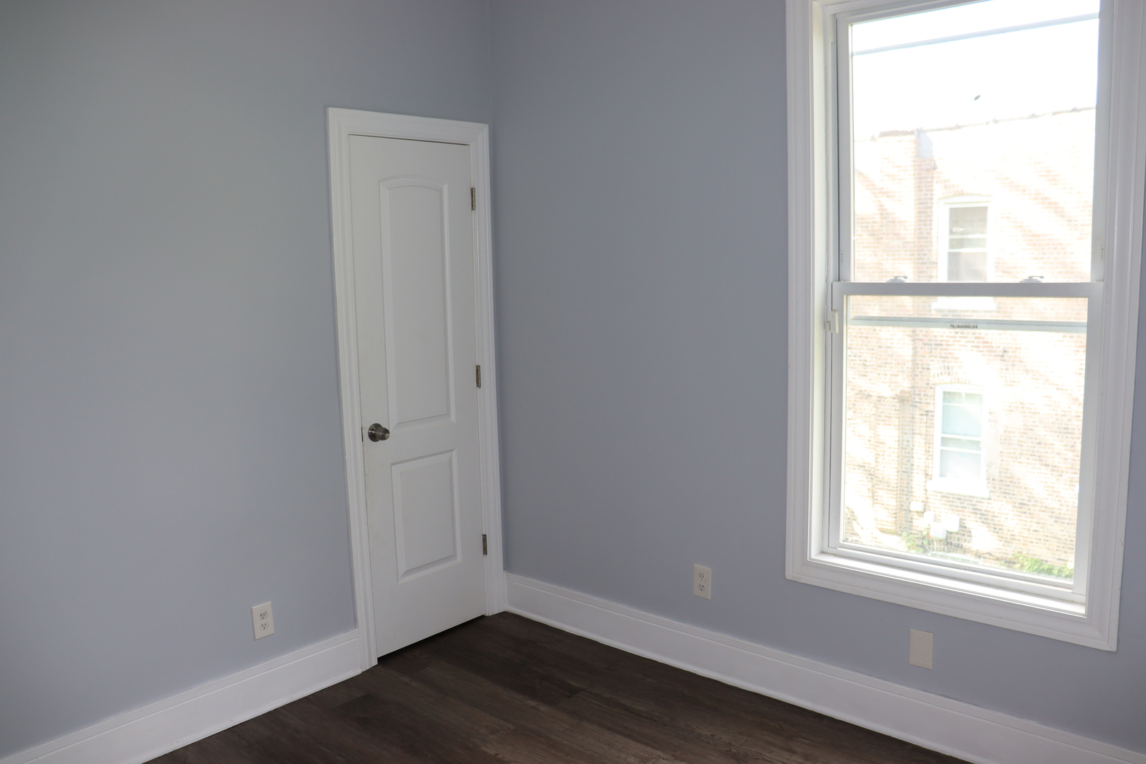 5718 South Sangamon Street, Unit 2 Chicago, IL 60621 - Photo 17 of 35 an empty room with wooden floor and windows