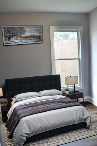 a bedroom with a bed and a view of bedroom