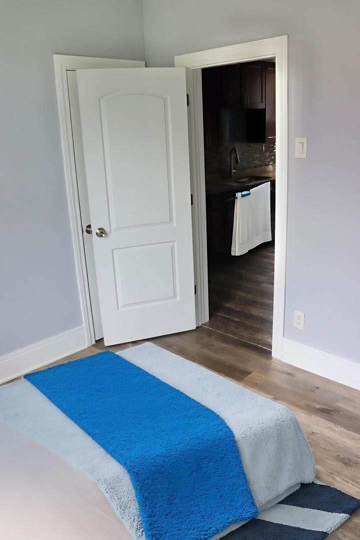 5718 South Sangamon Street, Unit 2 Chicago, IL 60621 - Photo 21 of 35 a bedroom with a bed and a view of bedroom