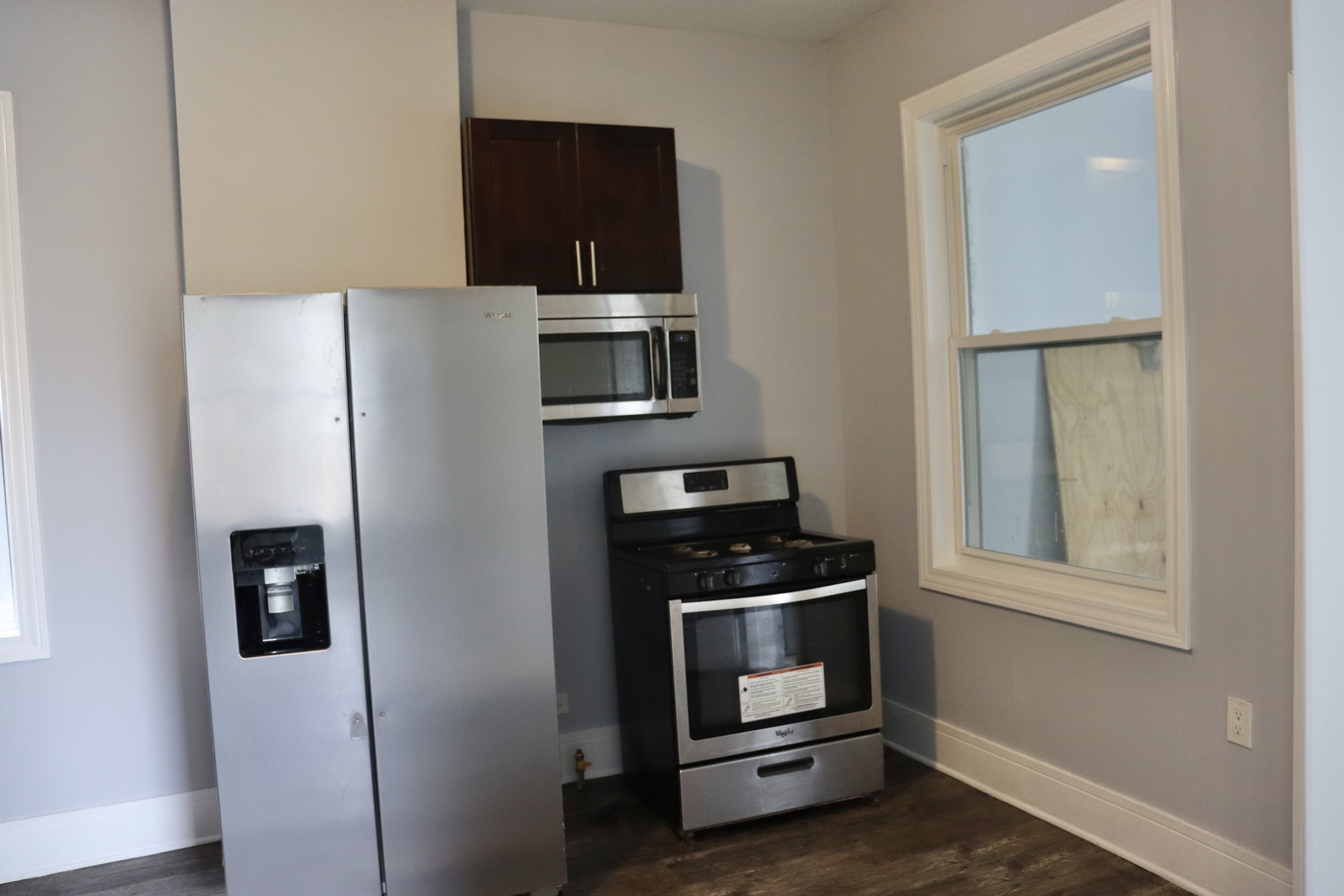 5718 South Sangamon Street, Unit 2 Chicago, IL 60621 - Photo 25 of 35 a kitchen with stainless steel appliances a refrigerator stove and microwave