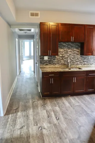 a bathroom with a sink and a mirror