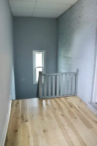 a view of entryway with wooden floor