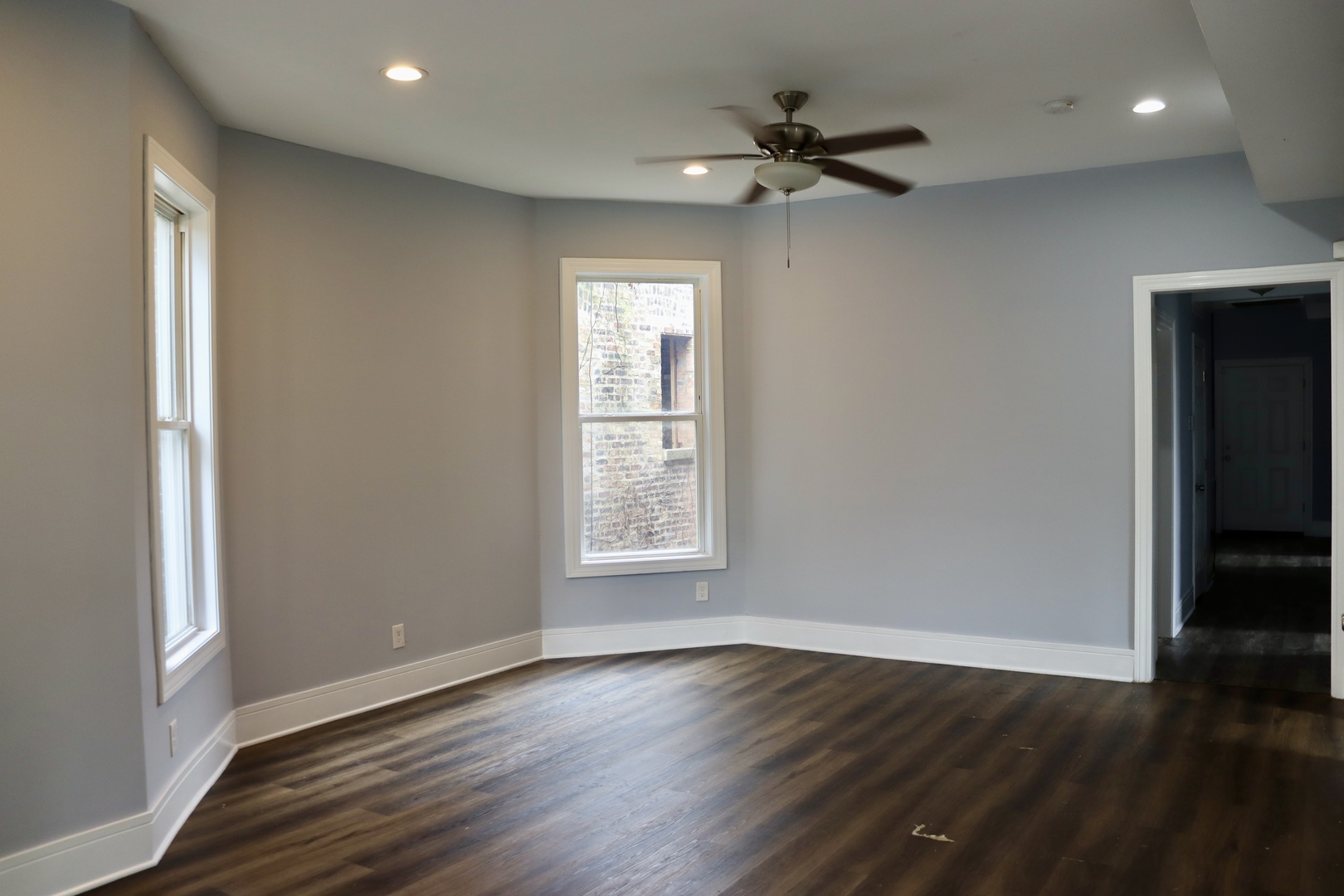 5718 South Sangamon Street, Unit 2 Chicago, IL 60621 - Photo 7 of 35 a view of an empty room with wooden floor and a window