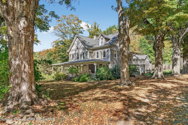 a view of a building with a tree in front