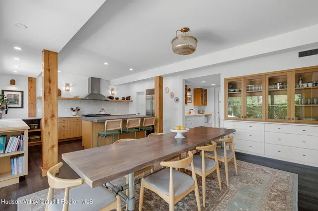 a dining room with furniture and window