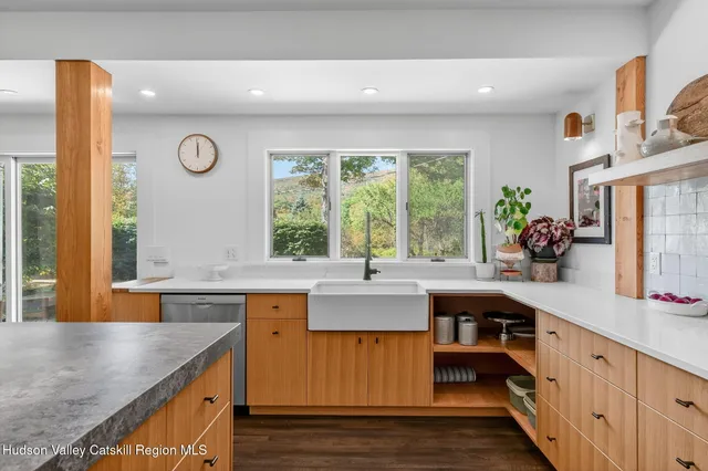a kitchen with a sink and wooden cabinets