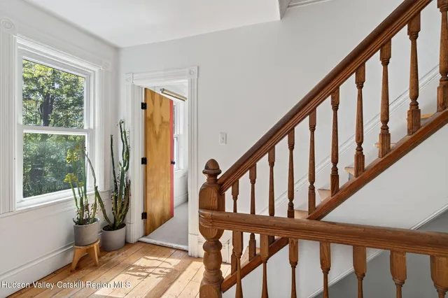 a spacious bedroom with a bed and a window