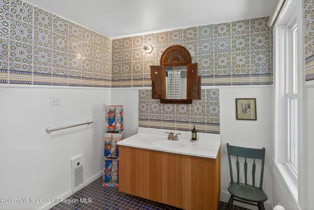a bathroom with a shower and a mirror