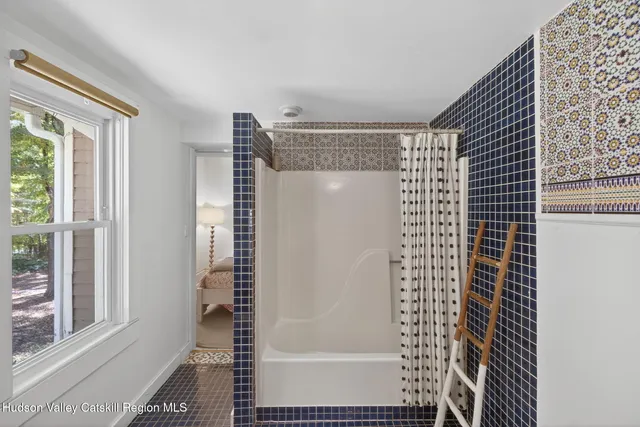 a bedroom with a large bed and a couch