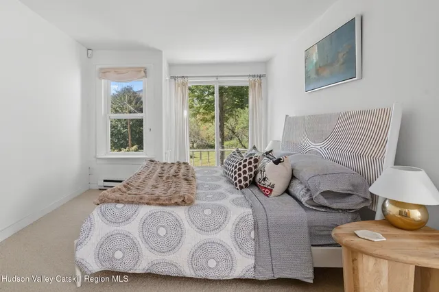 a living room with furniture and a rug