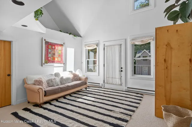 a room with a large window and a chandelier