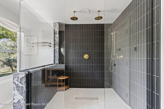 a bedroom with furniture and a lamp