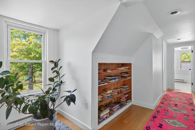 a bathroom with a tub sink and window