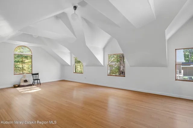 an aerial view of multiple houses with yard