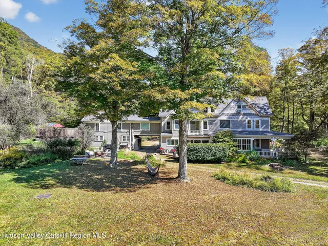 a front view of a house with a yard patio and fire pit