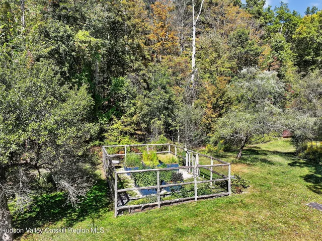 a view of a wooden fence and a bench