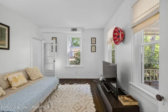 a bedroom with furniture and a window