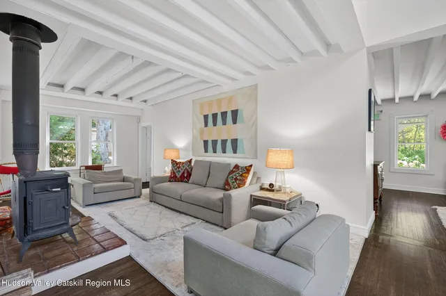 a living room with furniture and a lamp