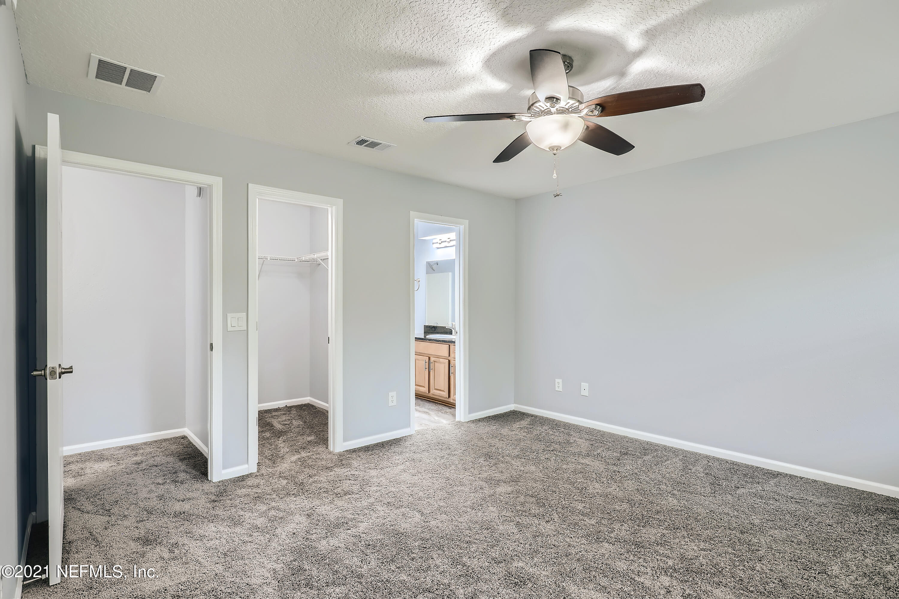 7915 Melvin Road Jacksonville, FL 32210 - Photo 16 of 32 15-437369922-35 2nd Floor Primary Bedroo