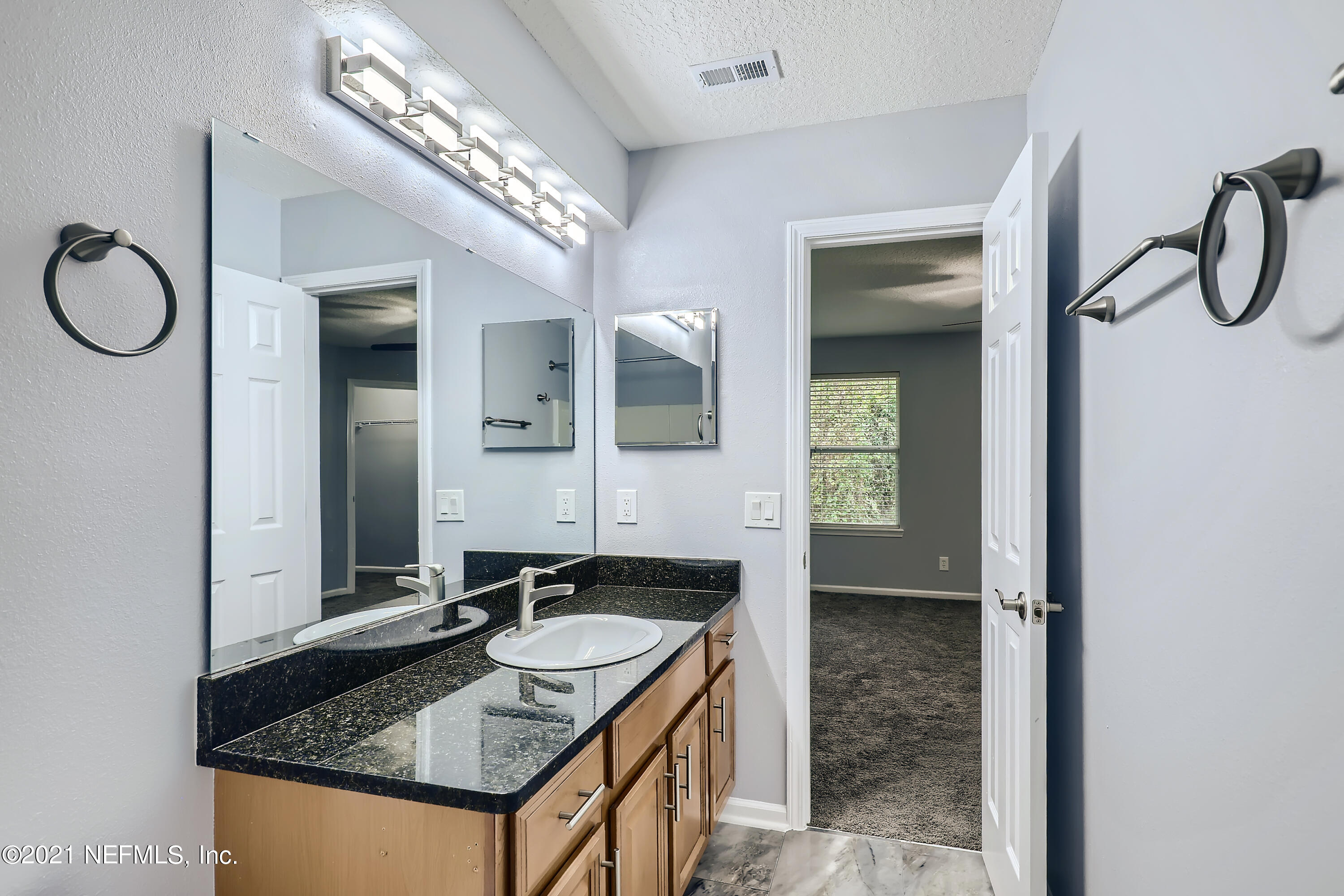 7915 Melvin Road Jacksonville, FL 32210 - Photo 19 of 32 18-286331588-38 2nd Floor Primary Bathro