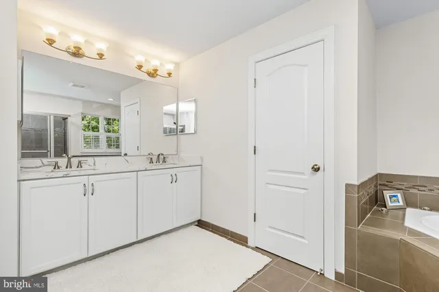 a work room with a window and a table chair