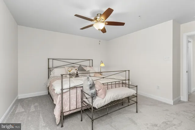 a bathroom with a sink vanity mirror and toilet