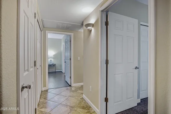 a view of a bathroom from a hallway