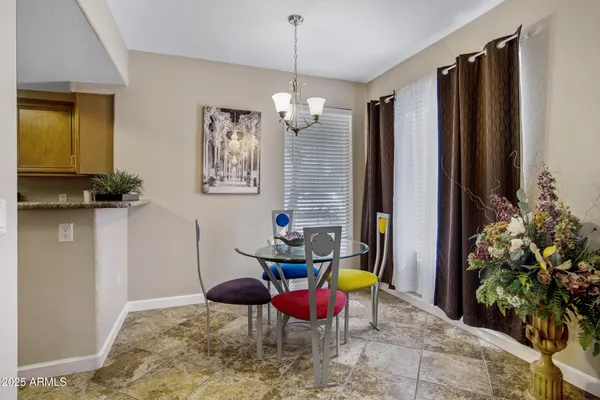 a dining room with furniture and window