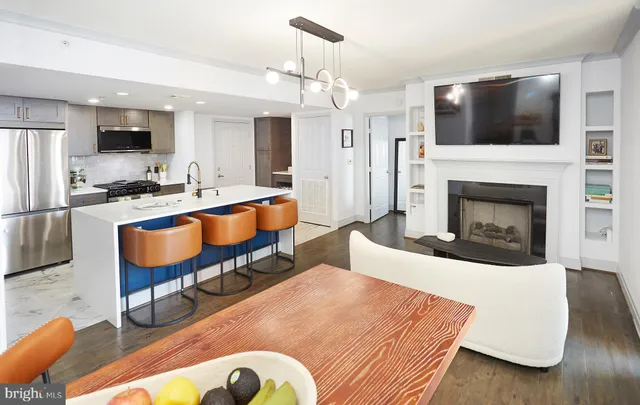 a living room with furniture fireplace and flat screen tv