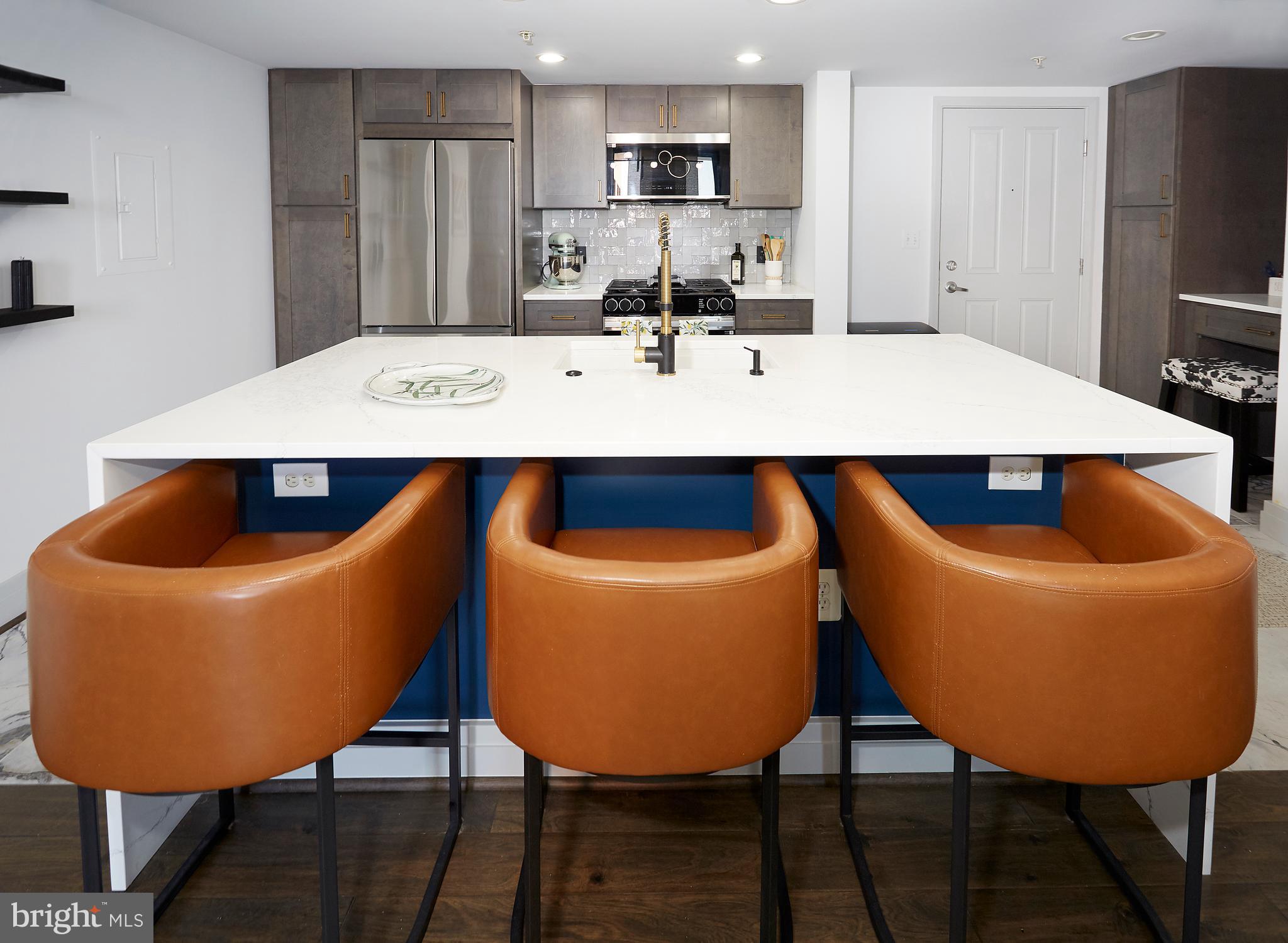 414 Water Street, Unit 2601 Baltimore, MD 21202 - Photo 14 of 51 a view of kitchen and dining area with furniture