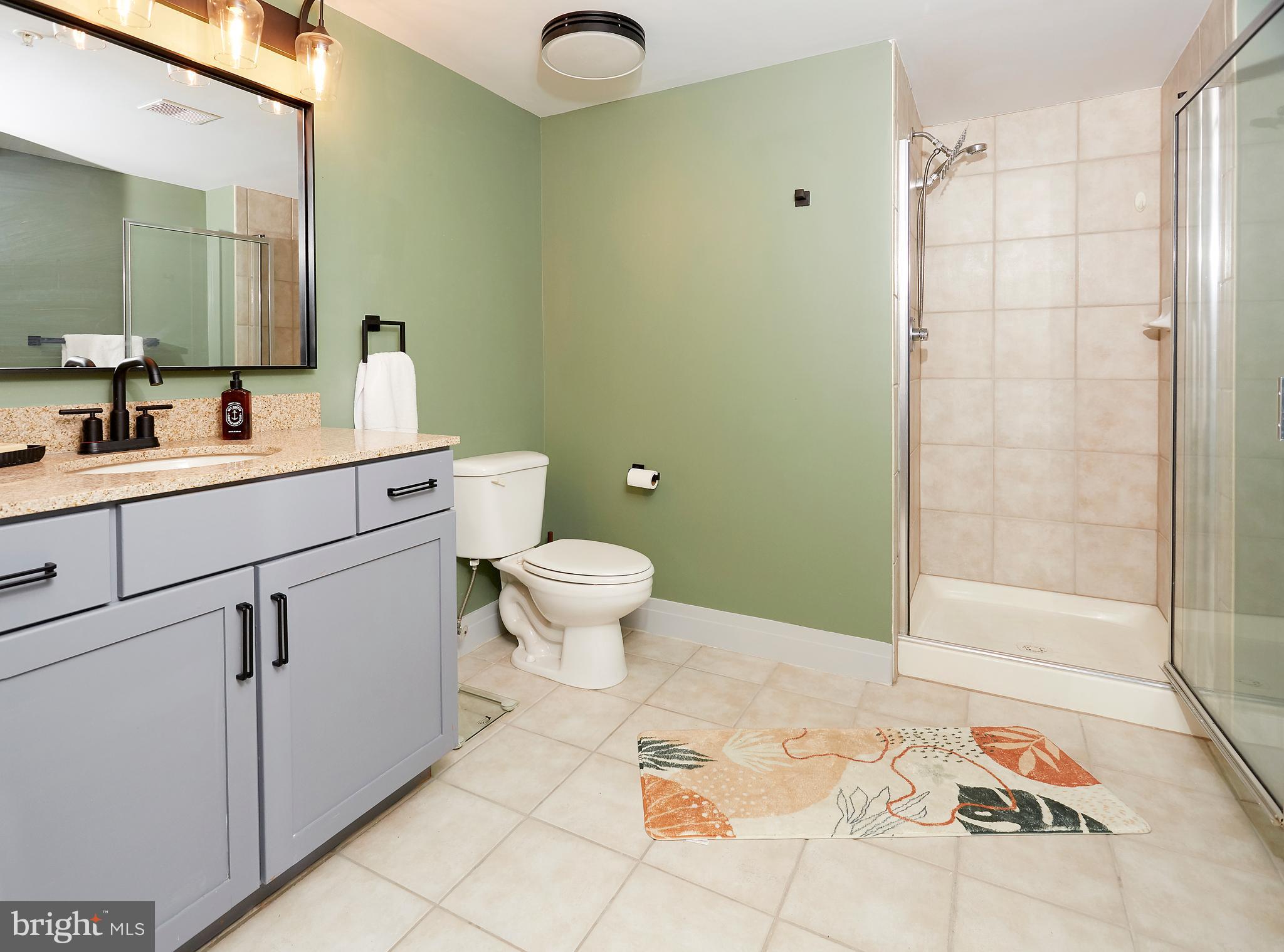 414 Water Street, Unit 2601 Baltimore, MD 21202 - Photo 25 of 51 a bathroom with a toilet sink and shower