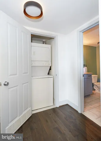 a living room with furniture and a piano