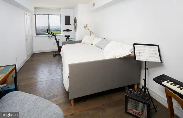 a view of a room with wooden floor