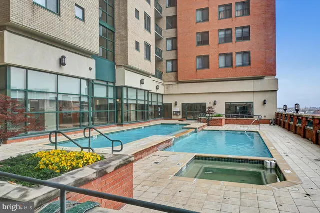 a view of a livingroom with workspace and a window