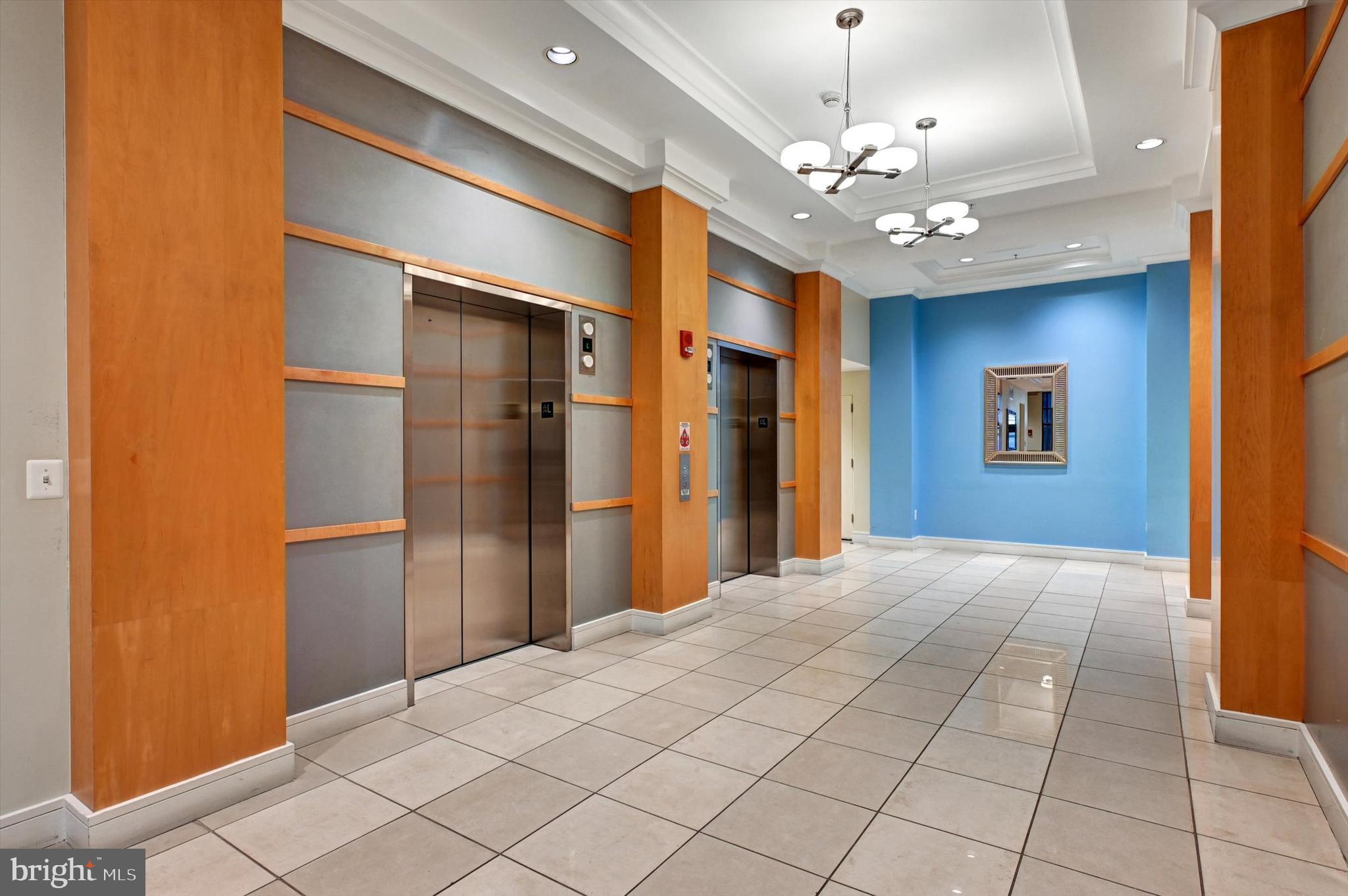 414 Water Street, Unit 2601 Baltimore, MD 21202 - Photo 49 of 51 a view of a hallway with a chandelier