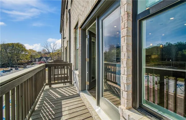 a view of a balcony with wooden floor