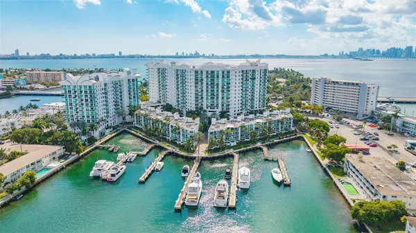 a view of a lake with couches chairs and city view